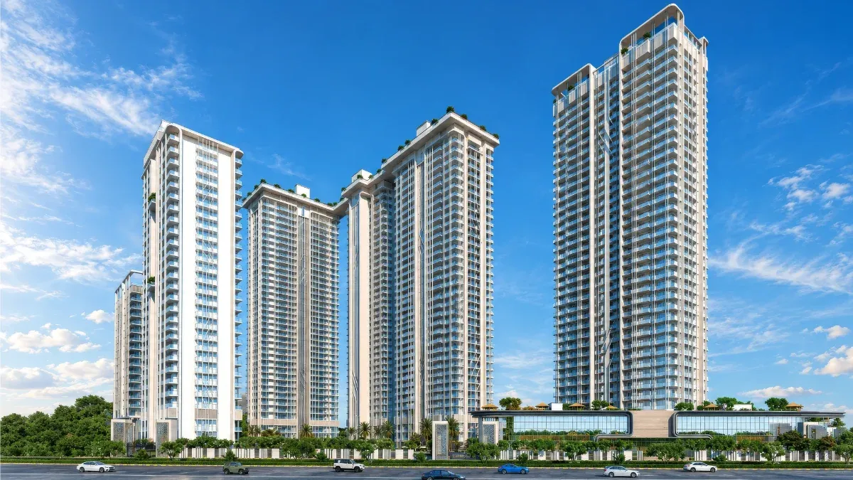 Central Park Delphine in Sector 104, Gurugram: white high-rise residential towers with glass balconies and rooftop greenery above a glass-fronted clubhouse