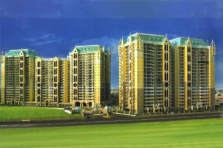 Gothic-style high-rise towers with green roofs above open lawns at DLF Express Greens, Sector 1, Manesar, Gurugram