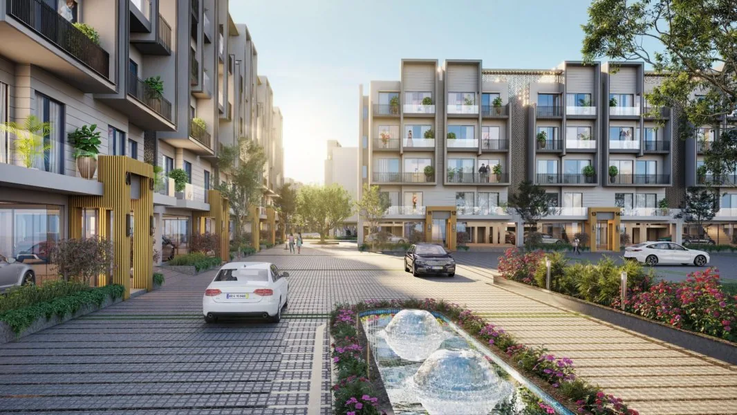 Four-storey floor blocks along a tree-lined driveway with a water feature, Smart World Orchard, Sector 61, Gurugram